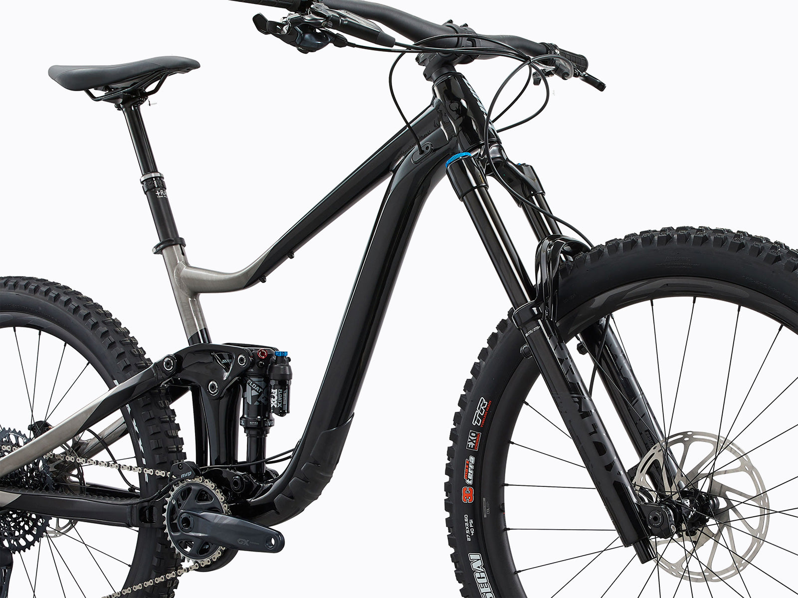 Close-up of a bicycle's front end, displaying a striking black and silver paint scheme.