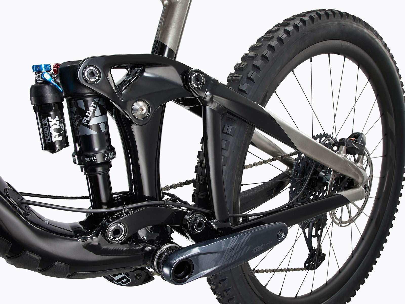 Detailed close-up of a bicycle's rear suspension system, highlighting its mechanics and functionality for improved ride comfort.