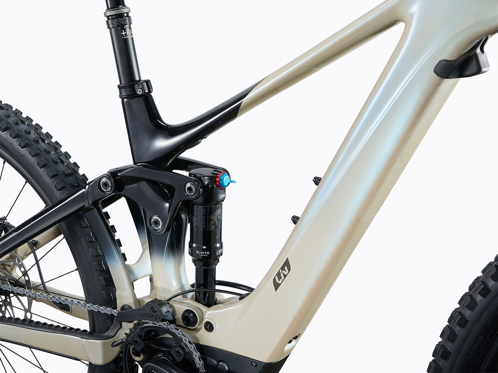 Close-up of a mountain bike's suspension system, highlighting its components and design for improved shock absorption.