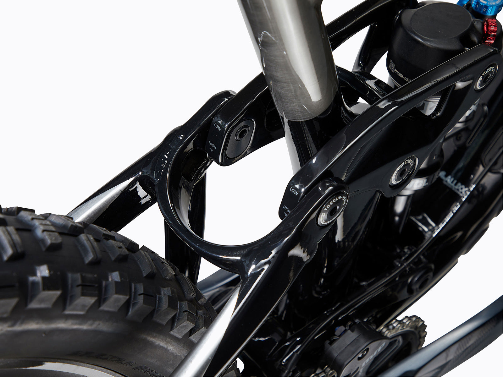 Detailed close-up of a bicycle's rear suspension system, highlighting its mechanics and functionality for improved ride comfort.